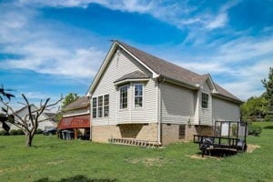 rear view of house with a lawn