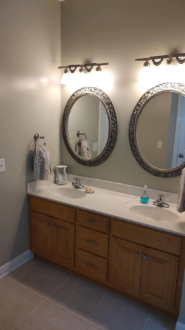 bathroom with tile patterned floors and double sink vanity