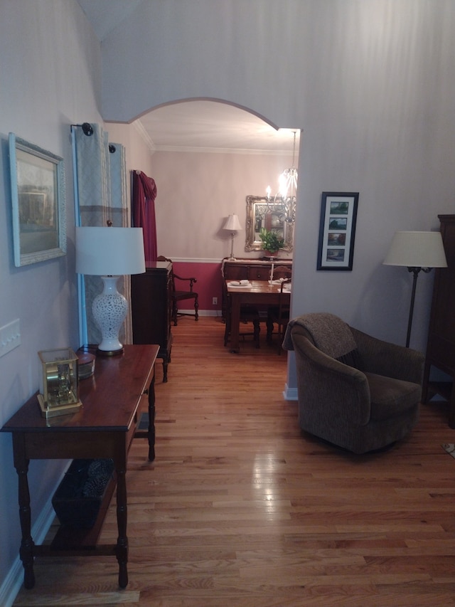 living room with a notable chandelier and hardwood / wood-style flooring