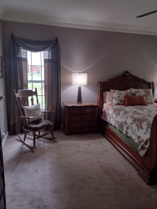 bedroom featuring crown molding and light carpet