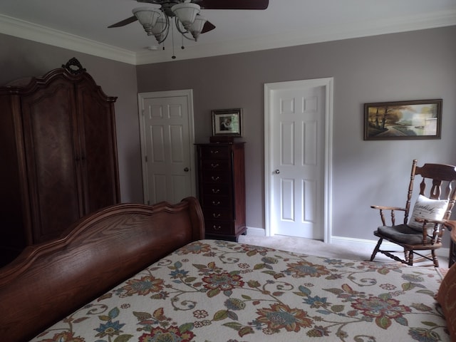 carpeted bedroom with crown molding and ceiling fan