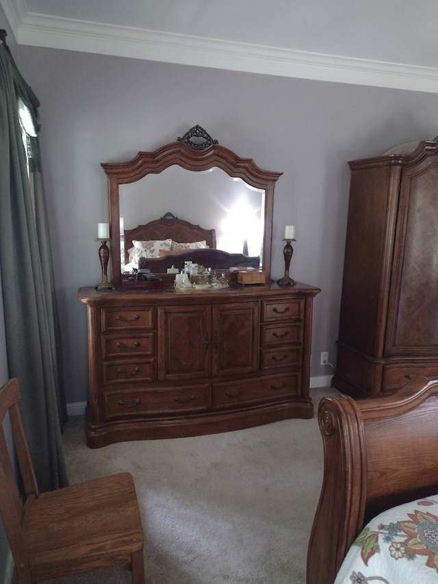 carpeted bedroom with crown molding