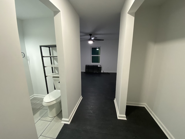 corridor featuring dark hardwood / wood-style flooring