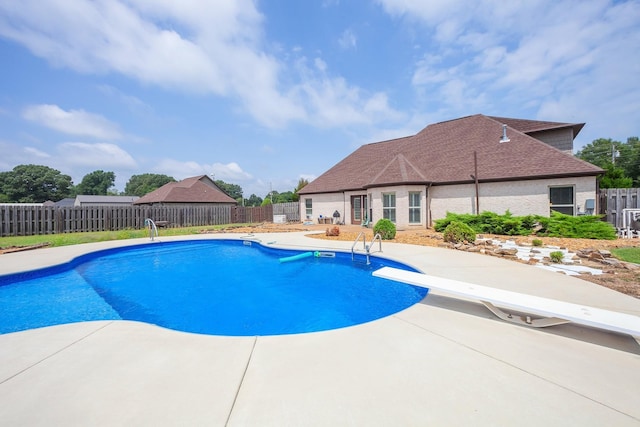 588 E Church St, Alamo, TN 38001 - view of pool with a diving board, a patio area, a fenced backyard, and a fenced in pool