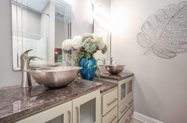 588 E Church St, Alamo, TN 38001 - full bath with baseboards, visible vents, and vanity