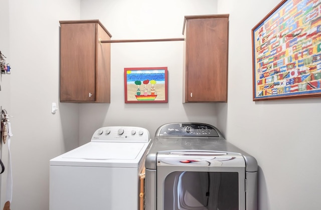 588 E Church St, Alamo, TN 38001 - washroom with separate washer and dryer and cabinet space