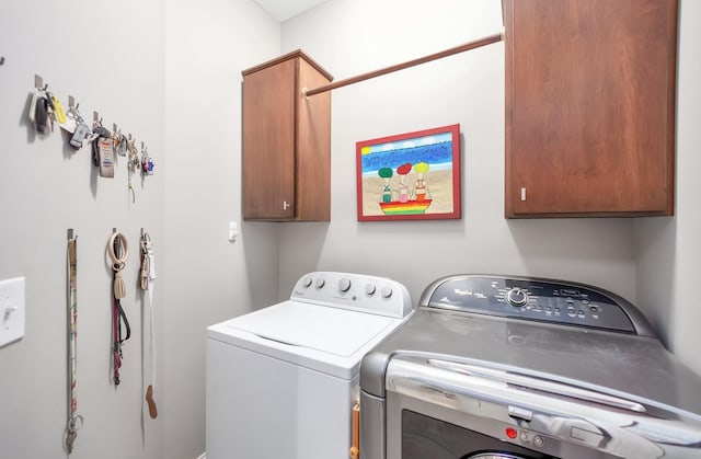 588 E Church St, Alamo, TN 38001 - laundry room featuring cabinet space and separate washer and dryer