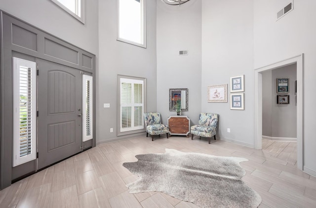 588 E Church St, Alamo, TN 38001 - entryway featuring visible vents, a towering ceiling, and baseboards