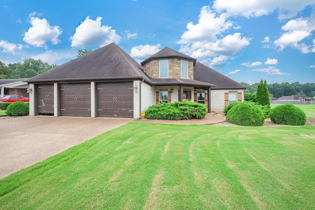 588 E Church St, Alamo, TN 38001 - view of front facade featuring a garage, concrete driveway, a front lawn, and stone siding