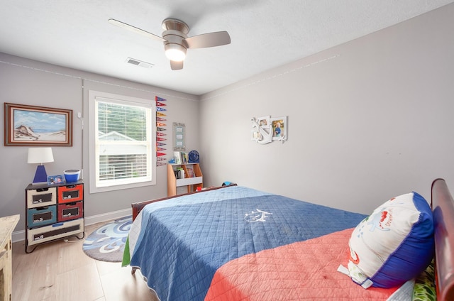 588 E Church St, Alamo, TN 38001 - bedroom featuring a ceiling fan, light wood-style flooring, visible vents, and baseboards