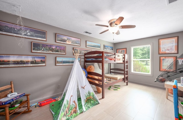 588 E Church St, Alamo, TN 38001 - bedroom featuring a textured ceiling, a ceiling fan, visible vents, and baseboards