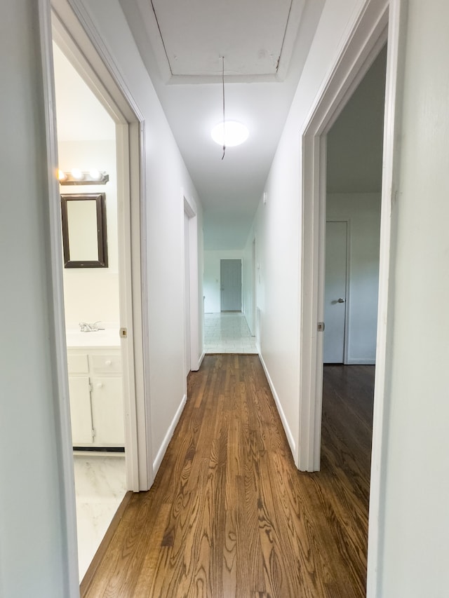 hallway featuring hardwood / wood-style flooring