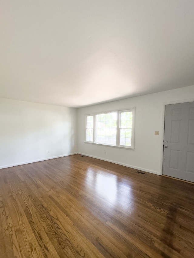 spare room featuring hardwood / wood-style floors