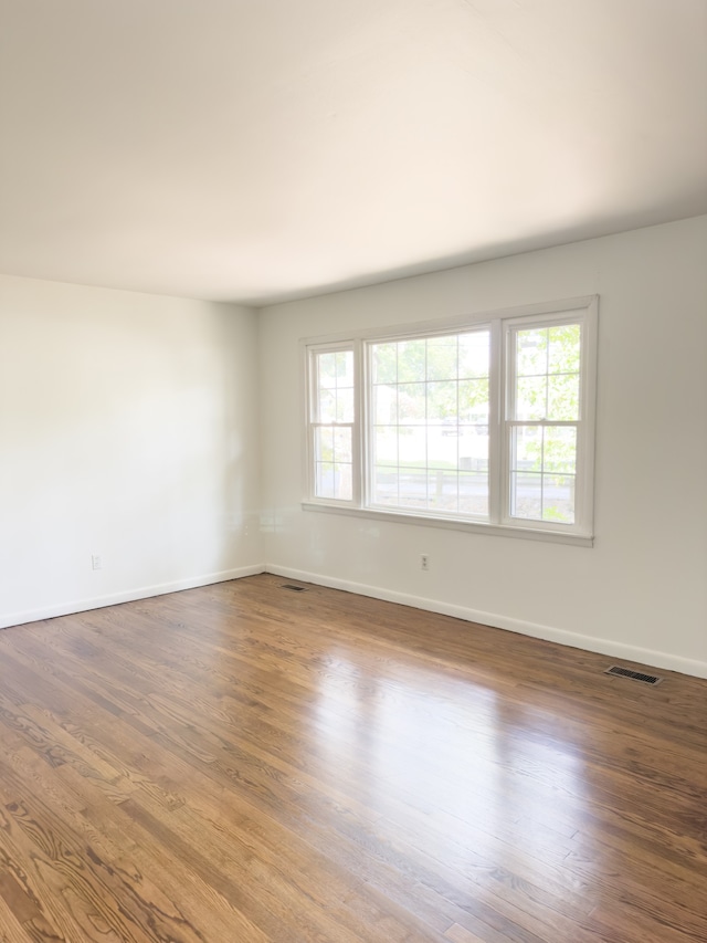 unfurnished room featuring wood-type flooring