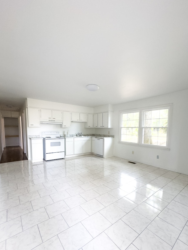 unfurnished living room with light tile patterned floors