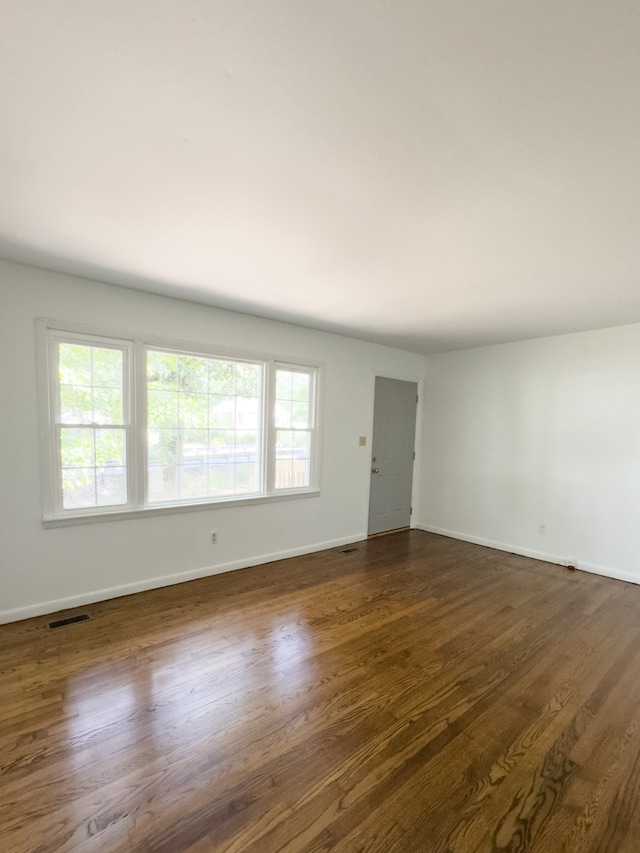 unfurnished room featuring hardwood / wood-style floors