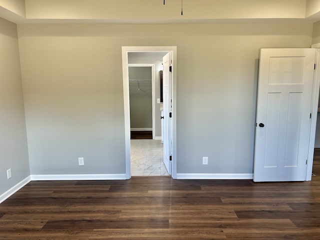 unfurnished room with dark hardwood / wood-style floors