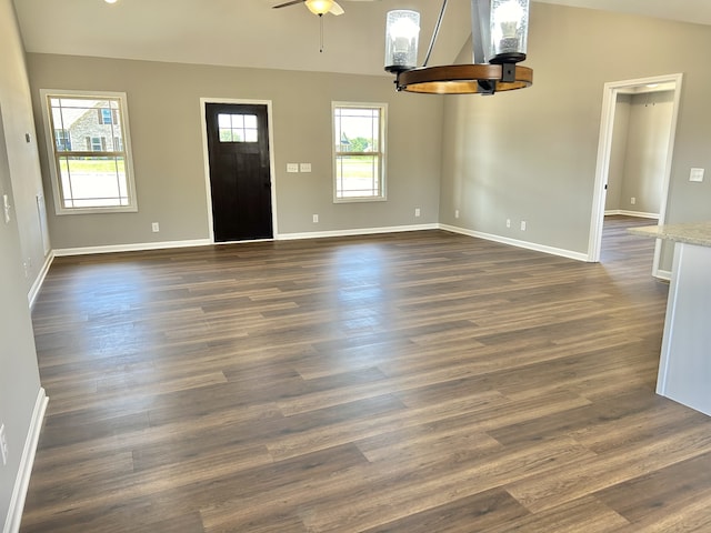 entrance foyer with ceiling fan, dark wood-type flooring, and vaulted ceiling