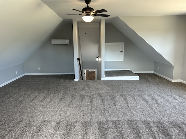 bonus room featuring a wall mounted AC, ceiling fan, dark carpet, and lofted ceiling