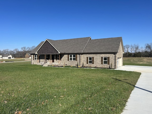 view of front of property featuring a garage and a front lawn