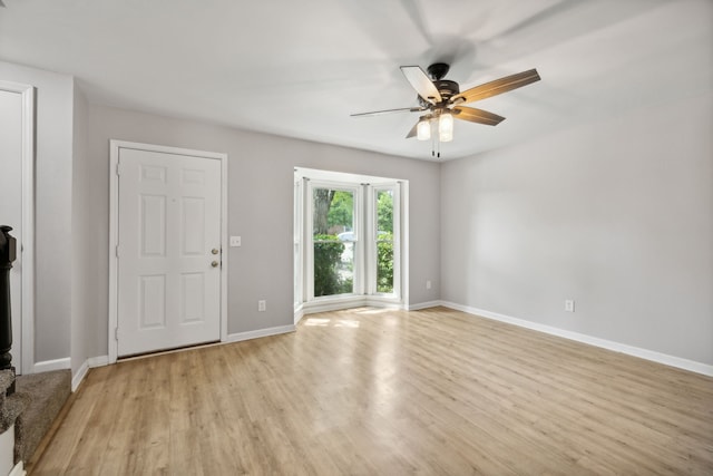 interior space with light wood-type flooring and ceiling fan