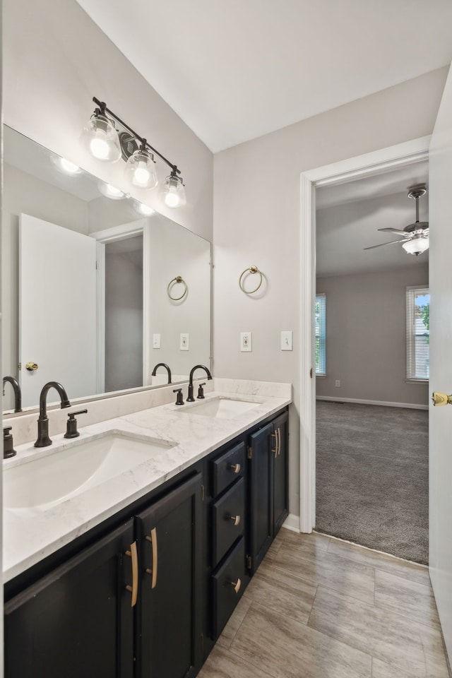 bathroom featuring dual vanity, tile patterned flooring, and ceiling fan