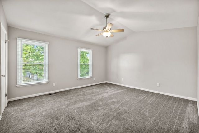 unfurnished room with lofted ceiling, carpet, and ceiling fan