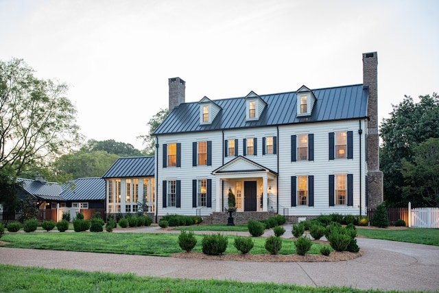 view of front of house featuring a front lawn and a porch