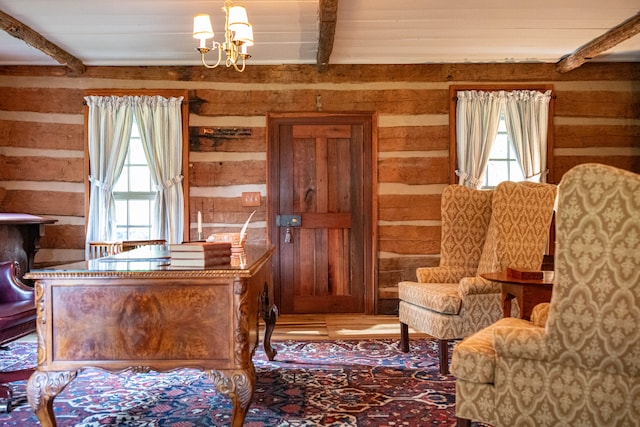 office area with beamed ceiling, a wealth of natural light, and hardwood / wood-style floors