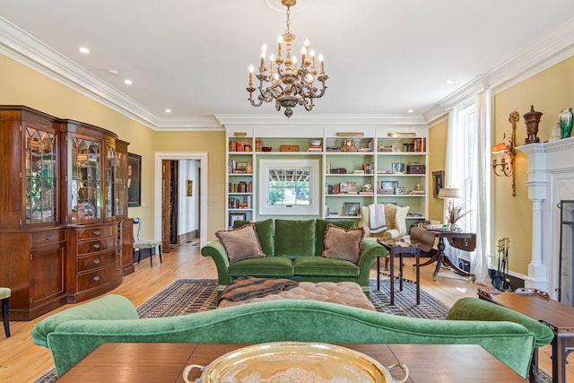 living room featuring a notable chandelier, ornamental molding, and light hardwood / wood-style floors