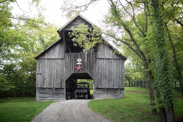 view of outdoor structure with a yard