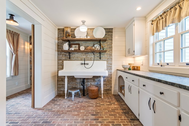 kitchen with white cabinets and crown molding