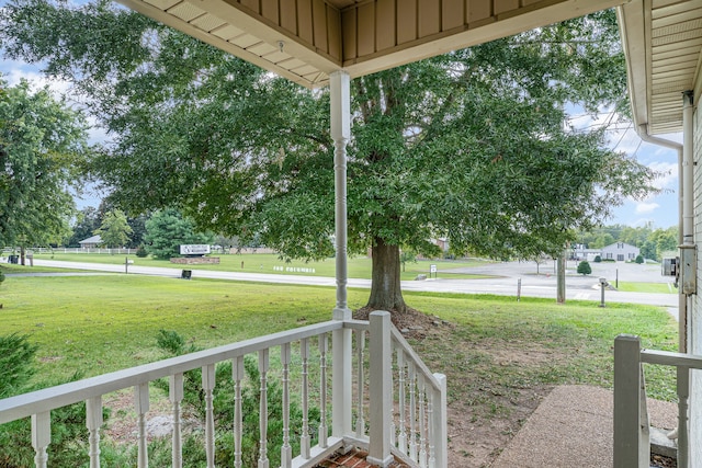 view of yard featuring covered porch