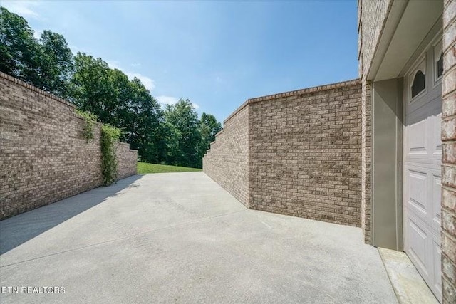 view of patio featuring fence