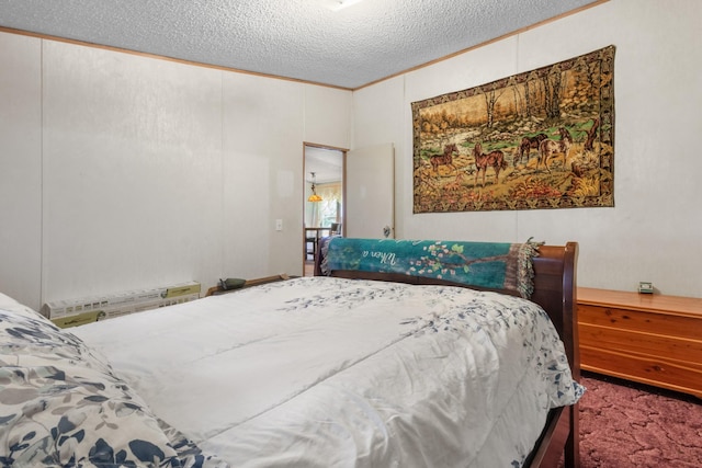 carpeted bedroom with a textured ceiling