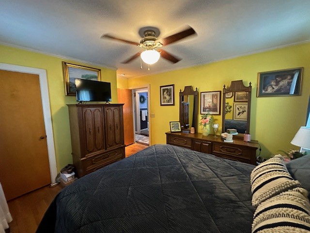 bedroom featuring hardwood / wood-style floors and ceiling fan