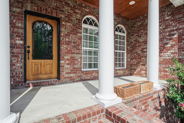 property entrance with covered porch