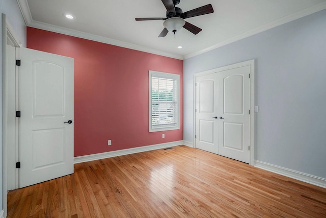 unfurnished bedroom with ornamental molding, ceiling fan, and light hardwood / wood-style flooring