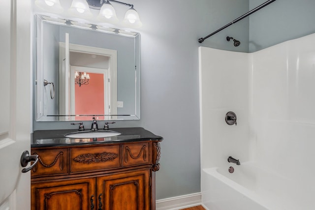 bathroom with shower / bathing tub combination and vanity