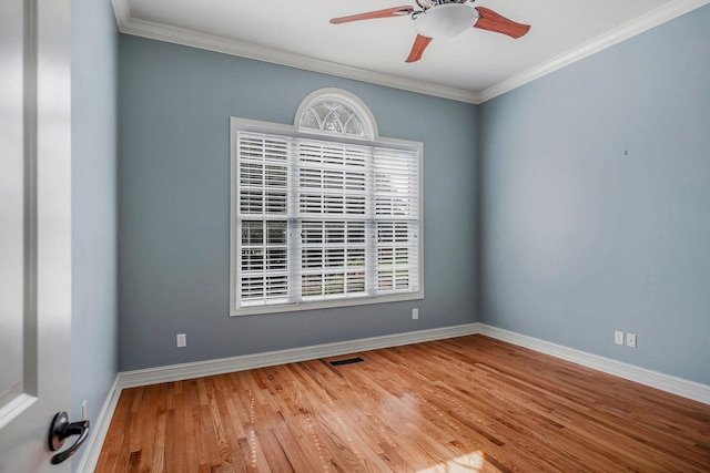 unfurnished room with ceiling fan, ornamental molding, and hardwood / wood-style floors