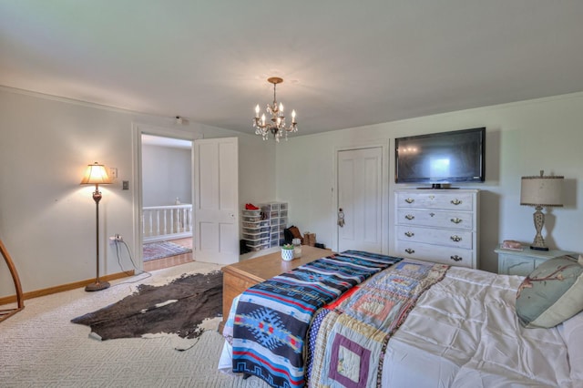 bedroom featuring carpet floors, a chandelier, and baseboards