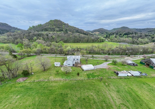 drone / aerial view featuring a mountain view and a rural view