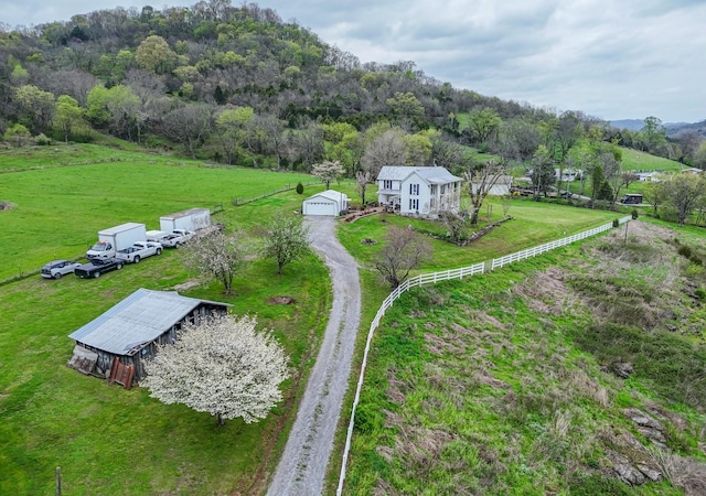 drone / aerial view with a rural view and a wooded view