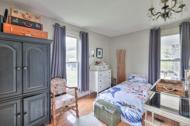 bedroom with light wood finished floors