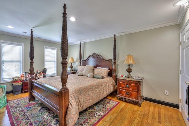 bedroom featuring light hardwood / wood-style flooring and ornamental molding