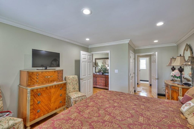 bedroom featuring ornamental molding and hardwood / wood-style flooring