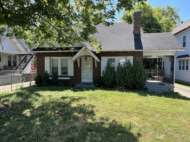 view of front of home with a front lawn