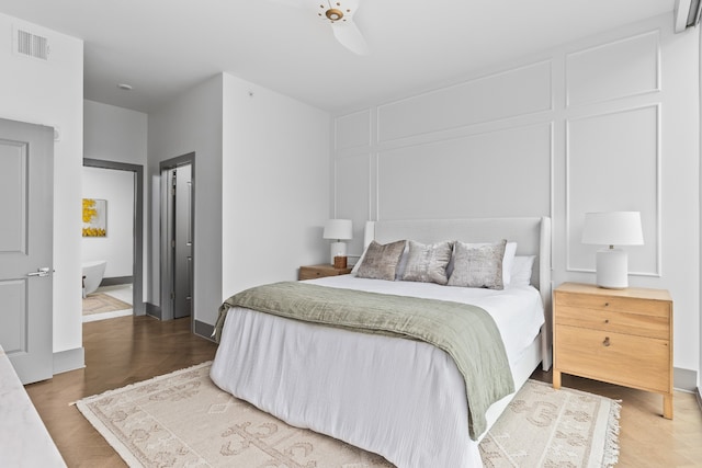 bedroom featuring ceiling fan and wood-type flooring