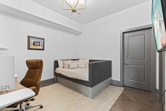 bedroom with an inviting chandelier and parquet floors