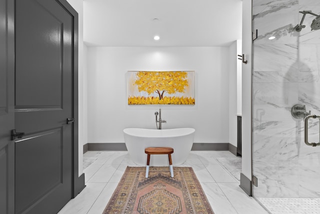 bathroom featuring tile patterned floors and independent shower and bath